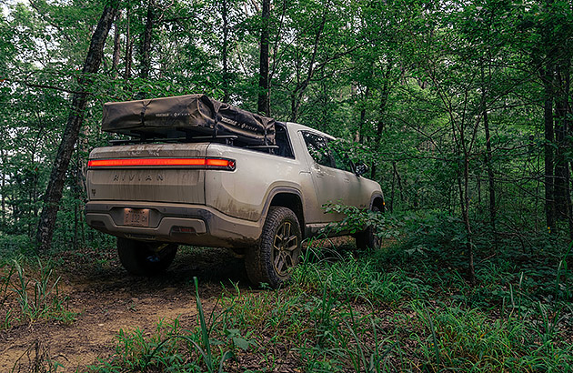 A Rivan electric 4WD on a forest track