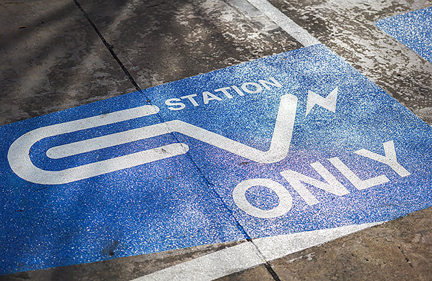 An EV only sign on at a public EV charging station