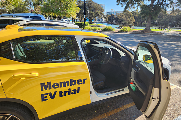 A Polestar 2 Electric Car with its door open in a car park