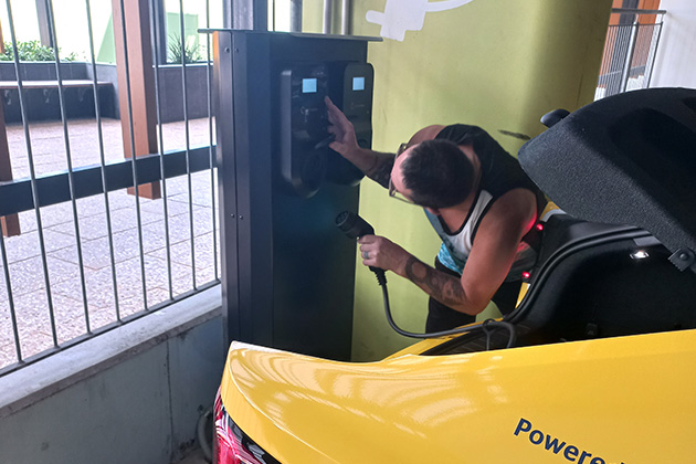 A man charging a Polestar 2 electric vehicle