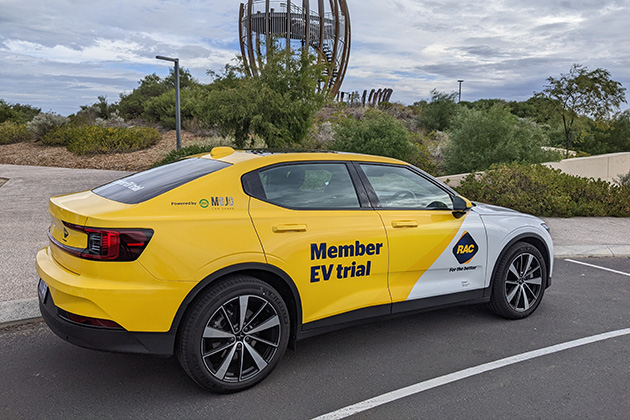 A Polestar 2 Electric Vehicle parked outside a monument