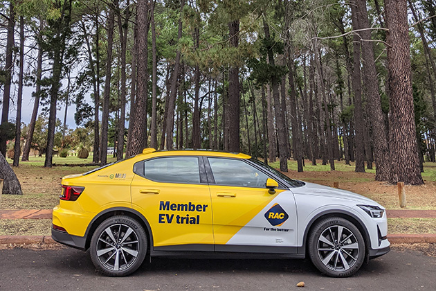 A Polestar 2 electric vehicle parked outside a local park