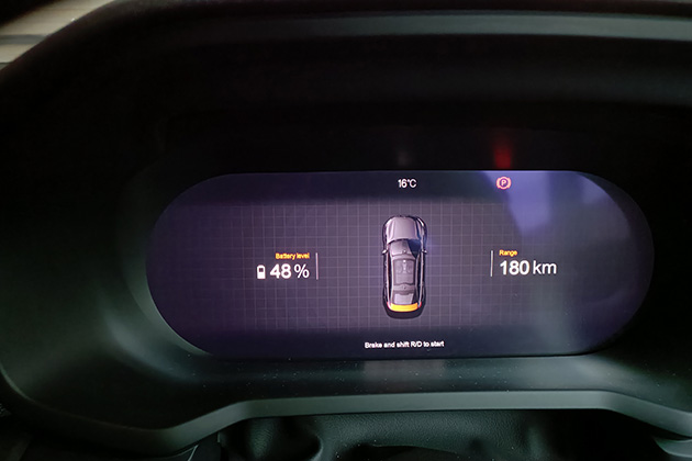 A gauge cluster showing battery level and range on a Polestar 2 EV