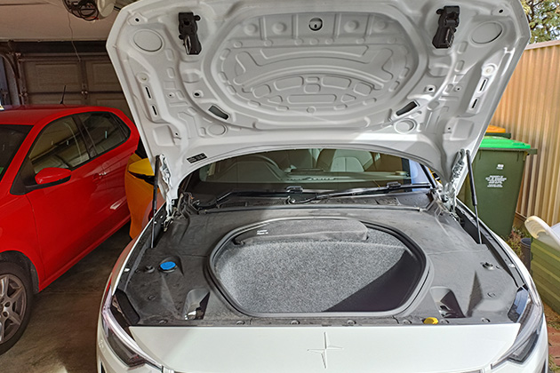 A Polestar 2's front storage compartment under the bonnet on display