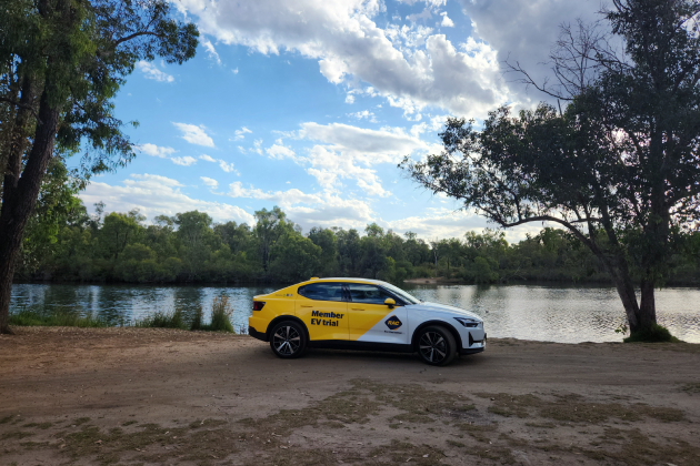 Yellow Polestar 2 parked in front of Minninup Pool in Collie River Valley