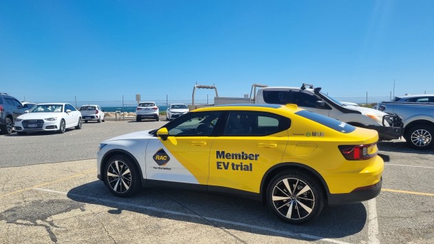 Yellow Polestar 2 electric car in parking lot at Fremantle jetty