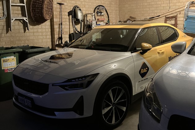 Polestar 2 electric car with yellow RAC branding parked in garage