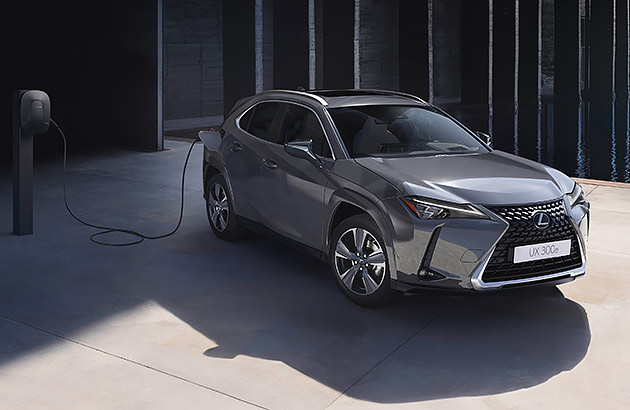 A silver grey Lexus UX 300e being charged