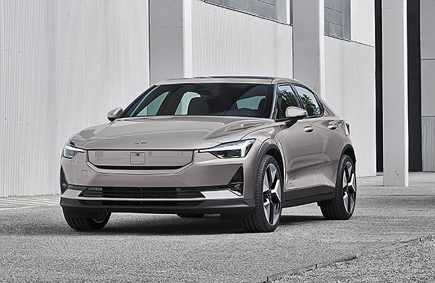 A white Polestar 2 parked on a city street