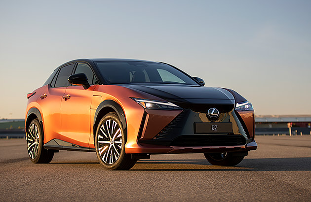 A light brown LEXUS RZ on a tarmac