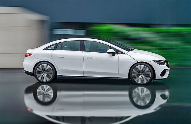 A white Mercedes-Benz EQE sedan on a reflective surface