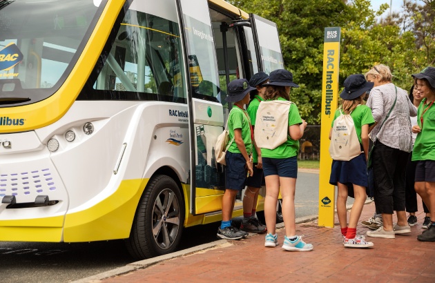 School students lining up to board Intellibus