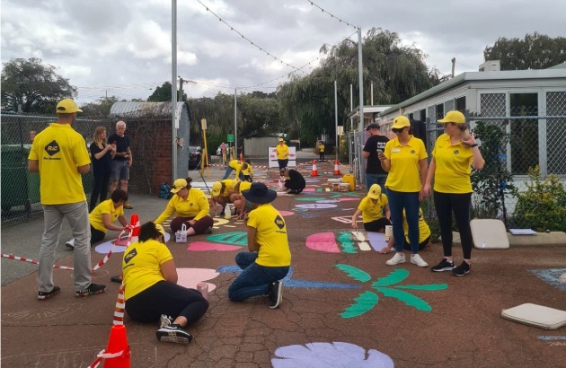 RAC people painting ground mural