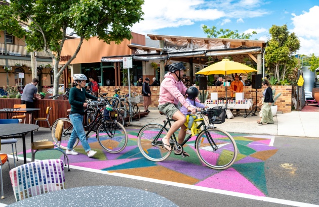 People riding bikes through bike hub