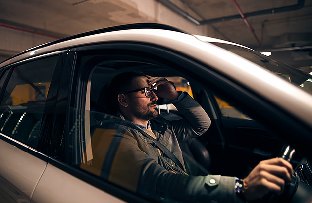 An annoyed driver waiting in a multi storey carpark