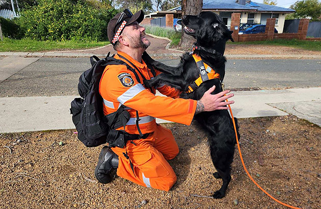 Dog owner Mark Smith with his black flat coat retriever Penny