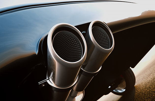 A close of a car's twin exhaust pipes