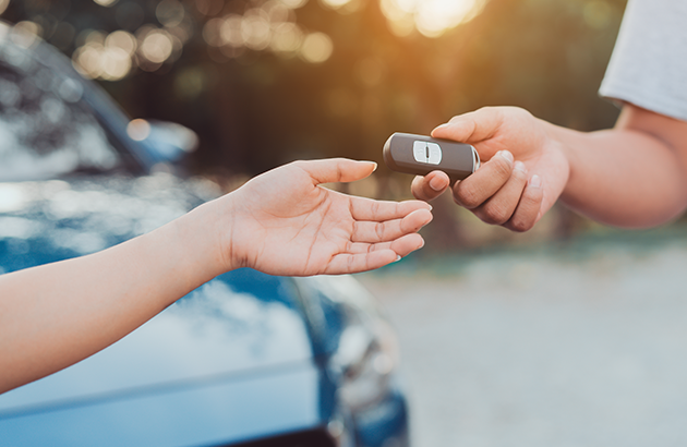 Car keys being handed over