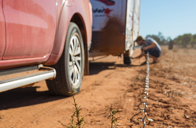 A tyre inflator being used on a caravan