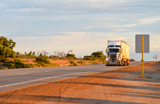 A truck driving down a highway in Australia