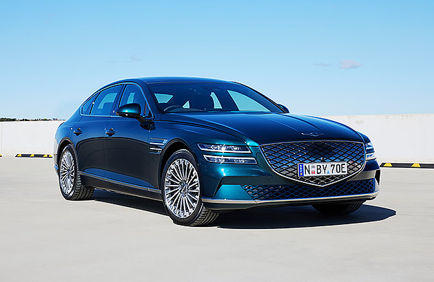 A blue Genesis Electrified G80 parked on a tarmac