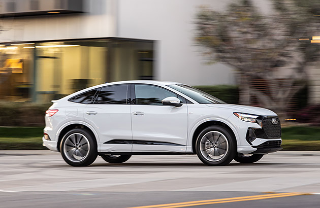 A white Audi Q4 e-tron-Sportback on a city street