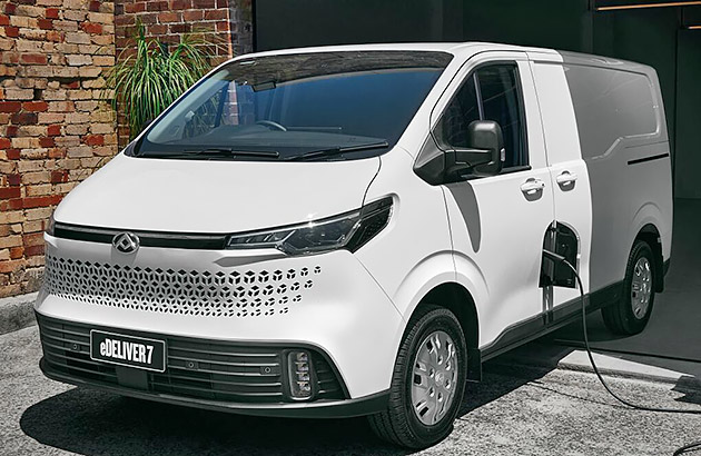 A white LDV e-Deliver 7 Van being charged on a driveway