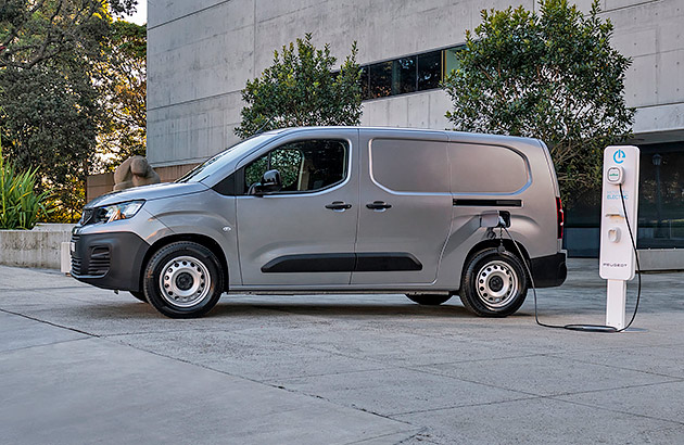 A silver Peugeot ePartner being charged