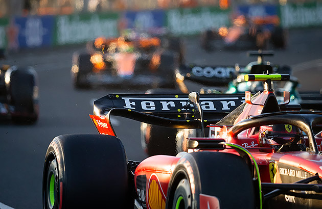 A black Ferrari Formula 1 car in a race