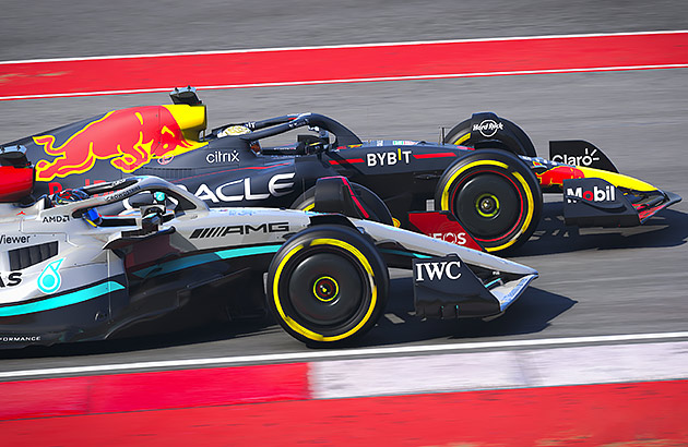 Two Formula 1 cars race side by side