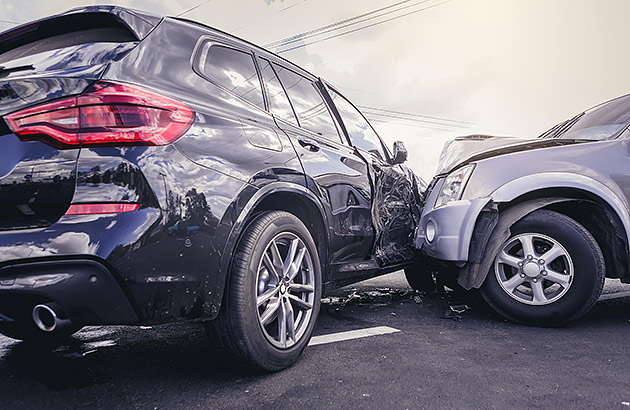 A close up of a side impact crash between two cars