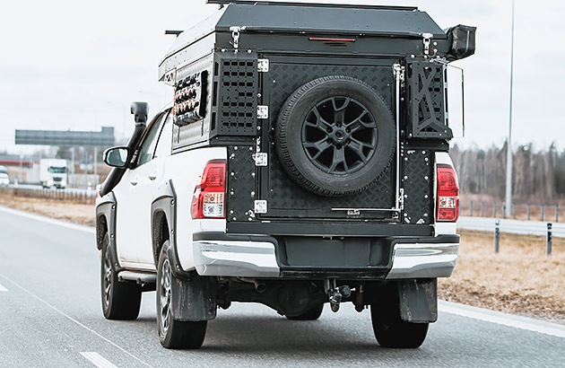 A 4x4 vehicle with a modified rear tray