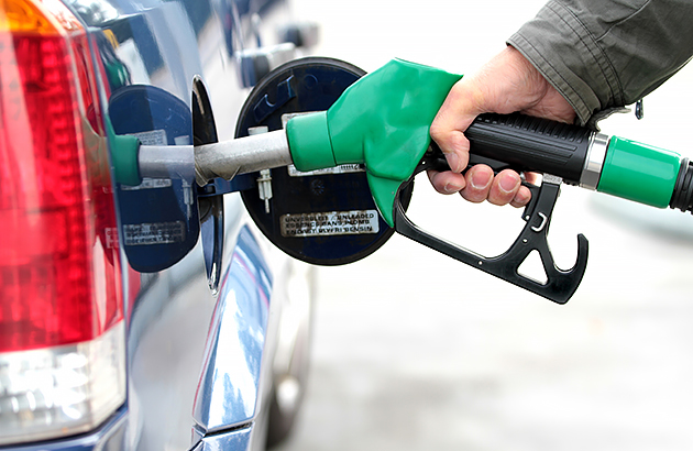 A close up of a person filling their car with fuel