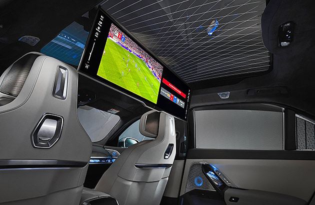 Interior of BMW 7 series vehicle showing the theatre screen