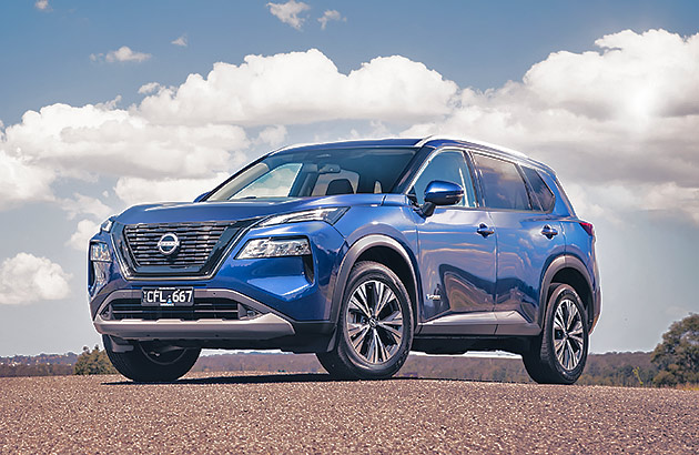 A blue  Nissan X-Trail parked on tarmac