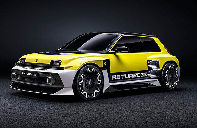 A bright yellow Renault 5 Turbo3E in a dark studio setting