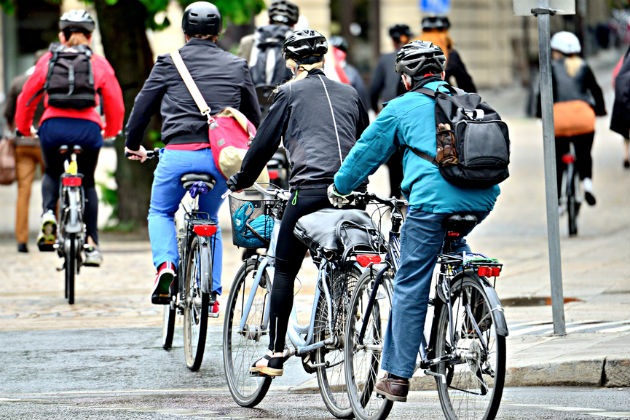 People commuting on bikes