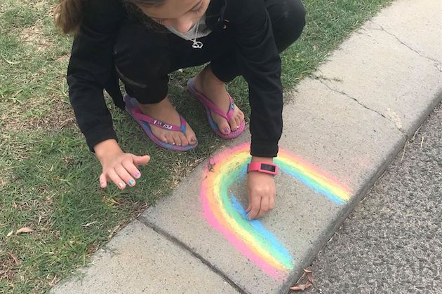 Image of girl painting chalk rainbow