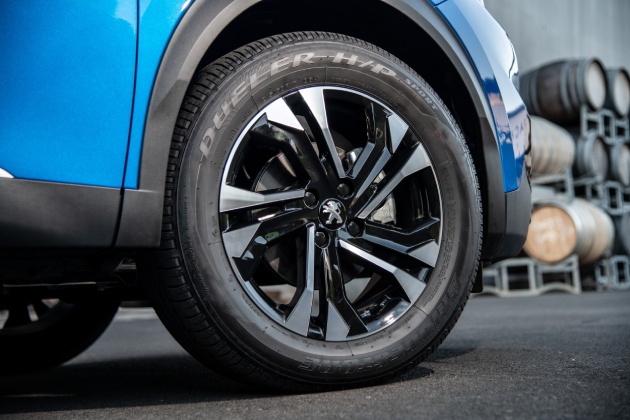 Front wheel of blue Peugeot