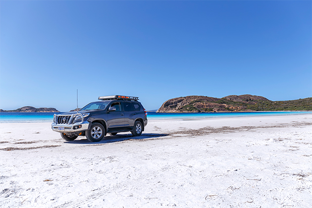 Image of four-wheel drive on beach