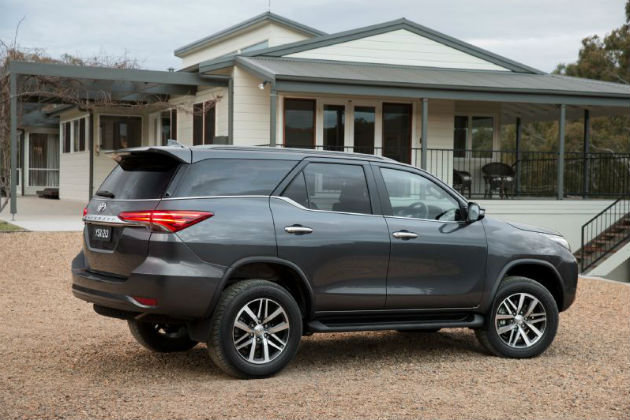 Toyota Fortuner in front of a house