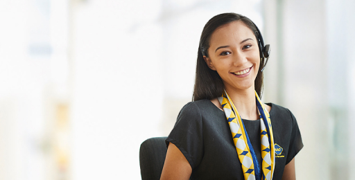 Smiling RAC staff wearing headset