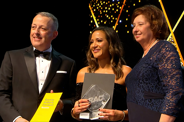 An RAC colleague being recognised for her achievements by the CEO and President of the Council