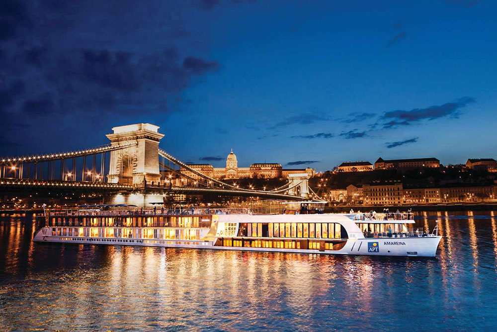 A ship sails along at night