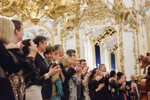 The audience applauds a concert in the Liechtenstein City Palace in Austria