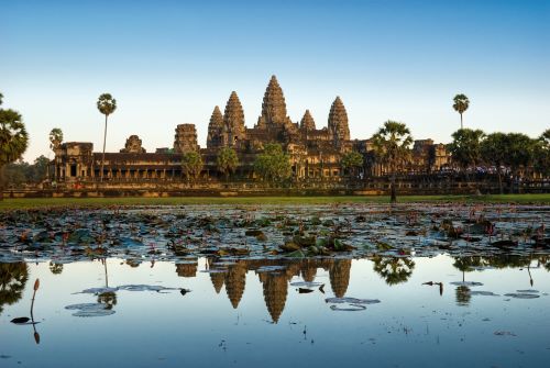 The grand Angkor Wat temple in Cambodia reflecting in the water