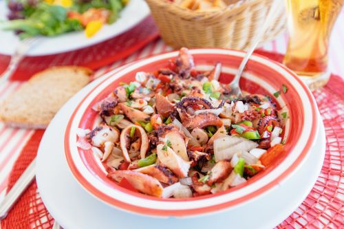 Closeup photo of a traditional Portuguese octopus salad 