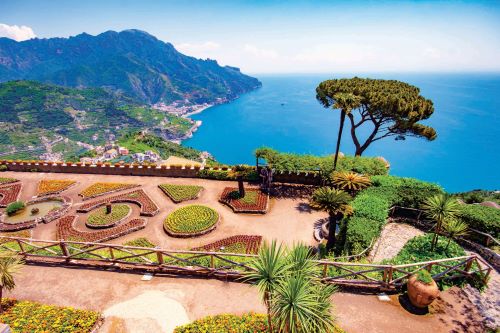 Panoramic view of the Mediterranean Sea from a lookout with meticulously designed gardens. 