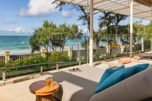 A comfortable daybed overlooking the beach