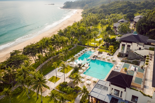 Aerial view of the resort pool with the beach in the background.